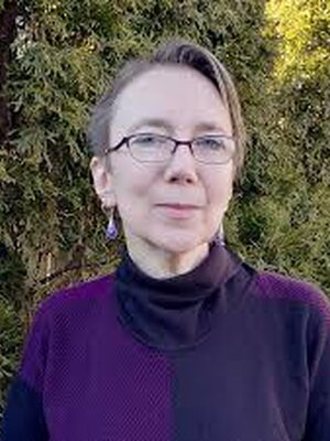 Picture of Judith Pintar, a woman with glasses and short hair. 