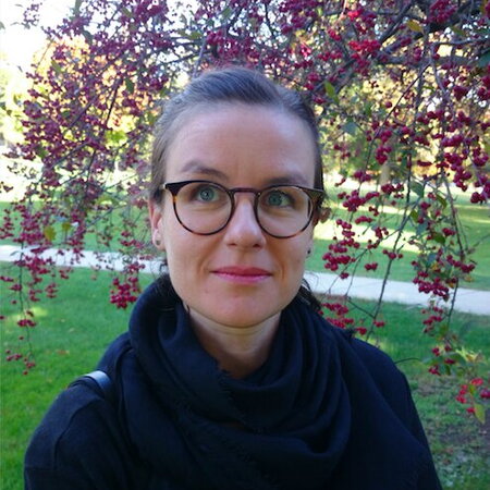 Picture of Julie, a woman with brown hair and glasses.