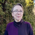Picture of Judith Pintar, a woman with glasses and short hair. 